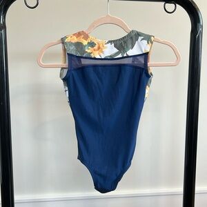 Lucky Leo Women’s leotard size S. Excellent condition. Navy/sheer/flowered